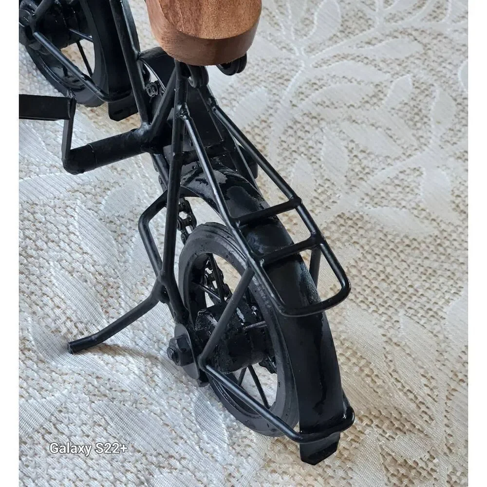 Cute black metal and wood standing bicycle decor with movable pedals and chain
